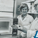Scientists putting food into a microwave oven